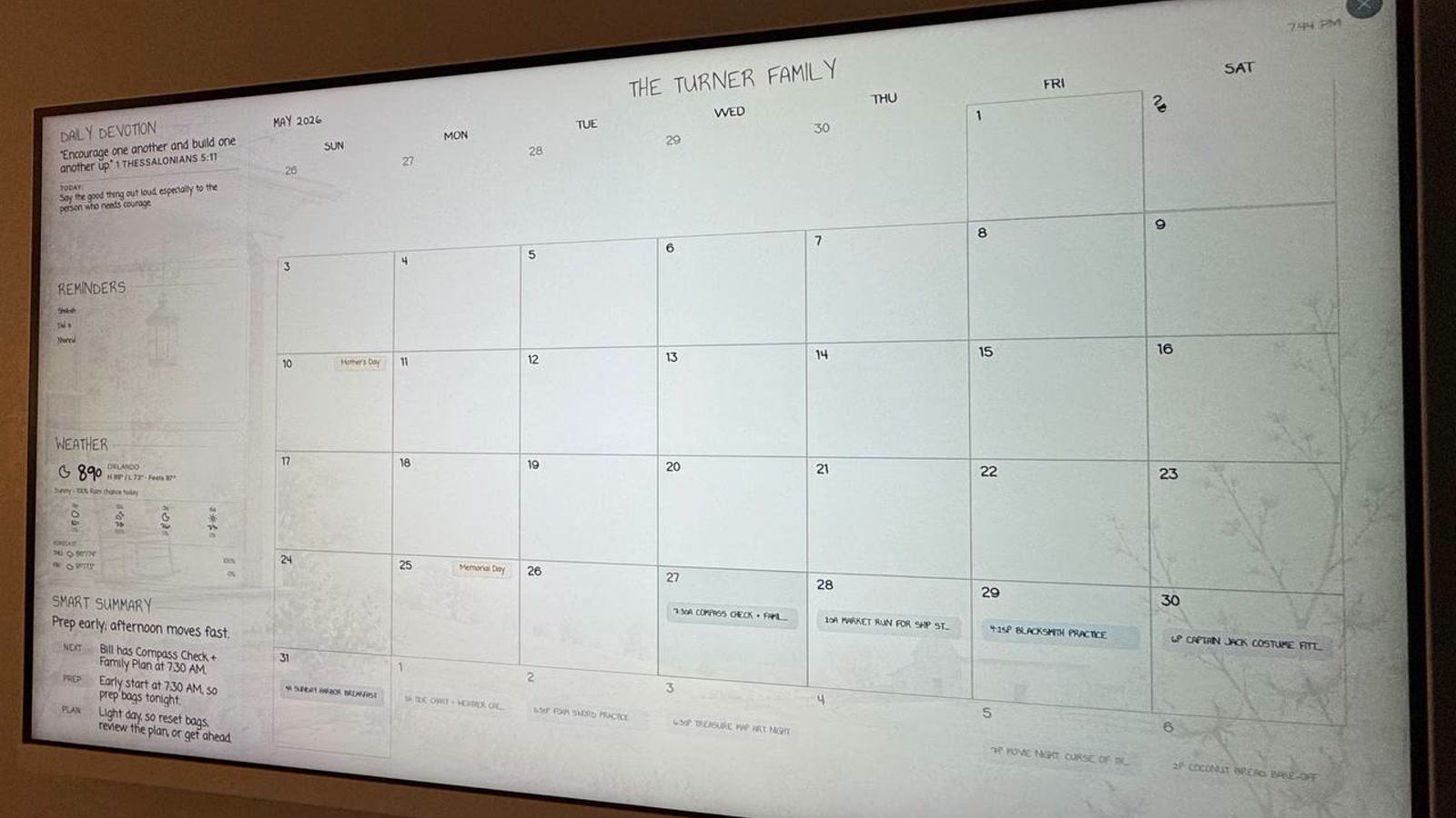 Farmark family calendar display running on a wall screen in a kitchen